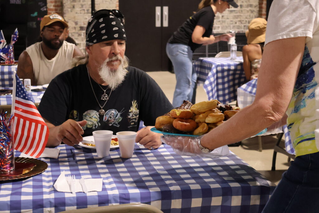 man being served breakfast at meal service