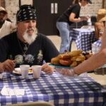 man being served breakfast at meal service